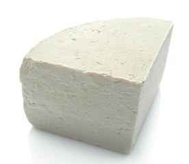Piece of feta cheese isolated on white