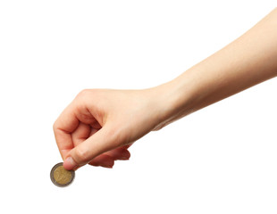 Female hand with coin isolated on white