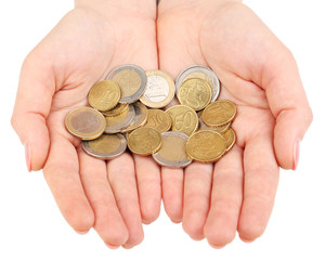 Female hands with coins isolated on white