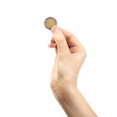 Female hand with coin isolated on white