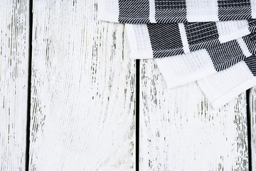 Checkered napkin on wooden table background