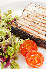 salmon steak with salad