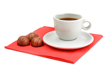 cup of coffee and chocolate candy isolated on white background