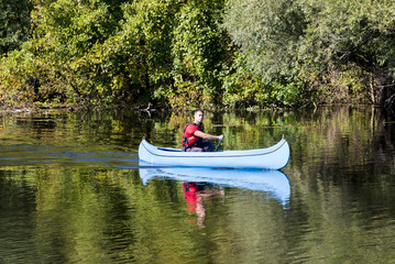 Fototapeta na wymiar Young man in canoe