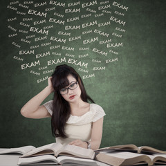 Dizzy student preparing for exam