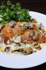 part of the chicken in a creamy sauce with mushrooms