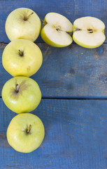 apples on blue background