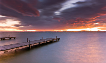 Fototapeta na wymiar Pier and sunset