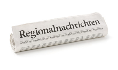 Zeitungsrolle mit der Überschrift Regionlanachrichten