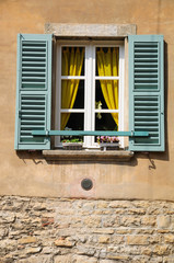 Obraz na płótnie Canvas Open shuttered window of old italian house in Verona.