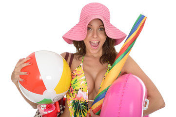 Young Woman Wearing a Swim Suit on Holiday Carrying a Beach Ball