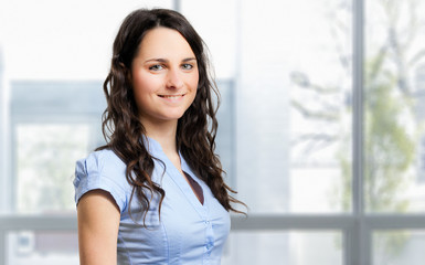 Smiling young female manager portrait