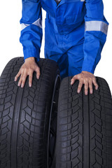 Obraz premium Mechanic with two black tires