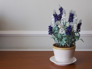 Beautiful flowers in a vase on wooden table