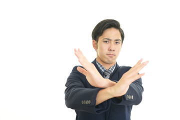禁止の意思表示をするビジネスマン
