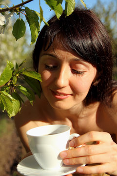 Beautiful girl holding a cup of tea
