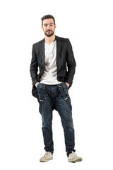 Smiling male model with hands in pockets