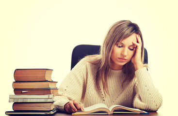 Woman tired because of studying