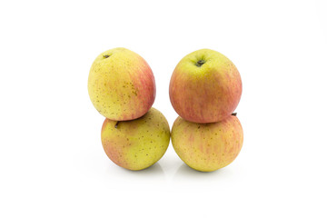 four apple still life on white background