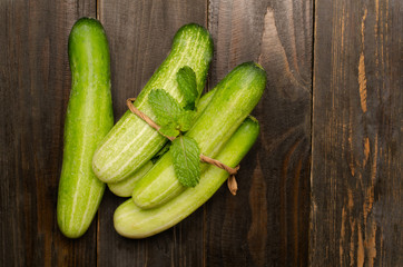 Fresh cucumber on wooden background