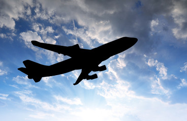 Airplane silhouette in the sunset