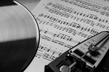 Metronome and vinyl on sheet music