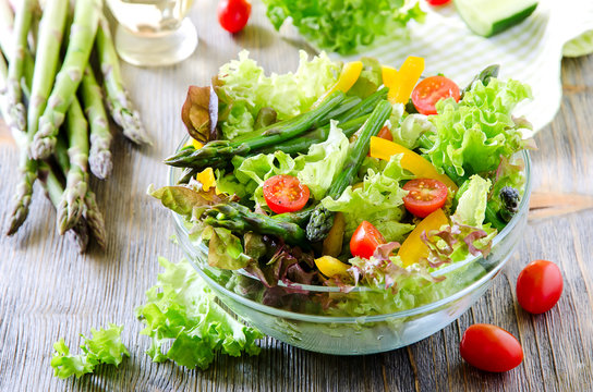 Fresh mixed salad with green asparagus for healthy snack