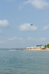 parachute in the sky over the sea