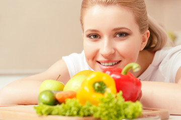 Young woman near vegetables