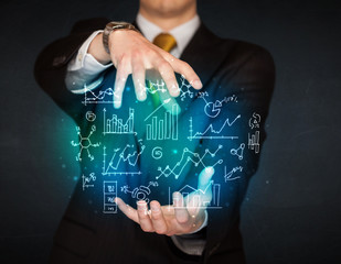 holding hand drawn business diagrams