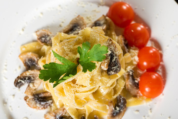 Pasta with mushrooms and tomato
