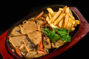 Tasty meat with fries