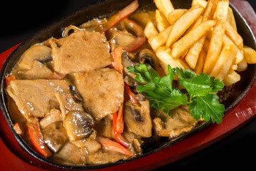 Tasty meat with fries