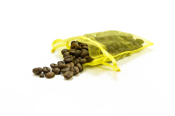 Coffee beans in gift bags on the white background