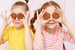 Two funny girls posing with cookies