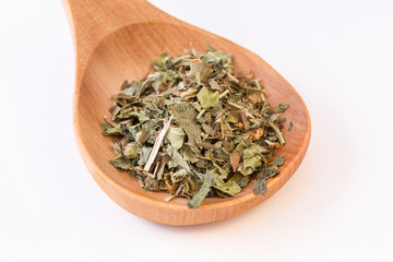 Infusion leaves in wooden spoon