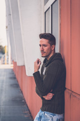 Young  man posing in an urban context