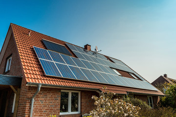 Fototapeta Solar panel on a red roof obraz