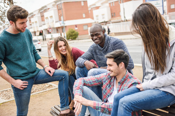 Group of friends having fun together outdoors