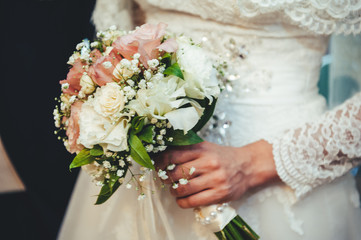 Wedding bouquet of flowers, close up. Young wedding couple