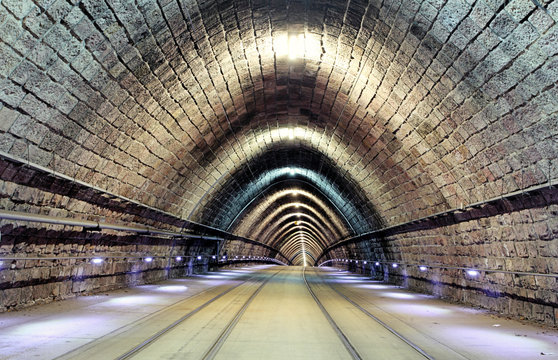 Tunnel with railroad and tram