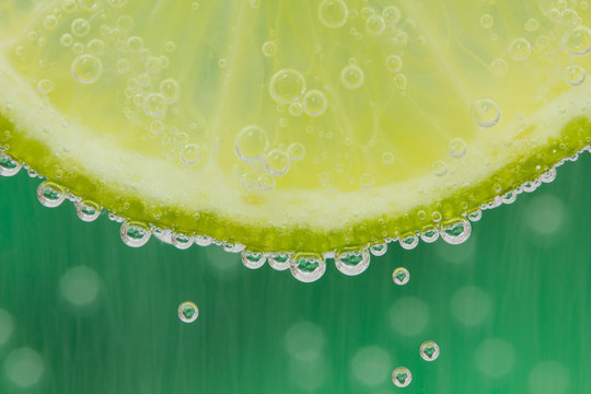 Green lime with water splash