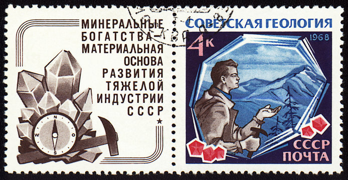 Geologist With Hammer On Post Stamp