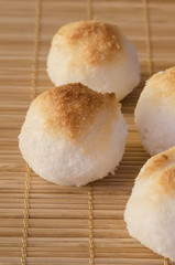 Coconut cookies as balls on bamboo background