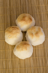 Coconut cookies as balls on bamboo background