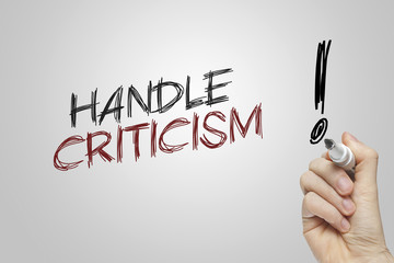 Hand writing handle criticism - obrazy, fototapety, plakaty