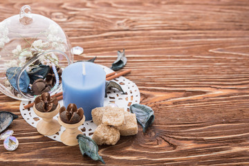 spa stuff on wooden background: candle, aroma