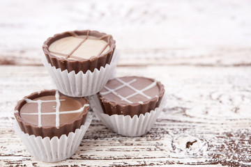 Dark chocolate on wooden background