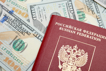 Russian passport with American dollars