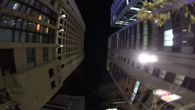 Vertical nightscape of Tokyo skyscrapers.